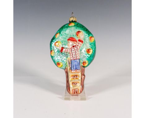 Hand-painted, this glass ornament captures the essence of an apple tree with a boy on a ladder picking apples. The matte fini