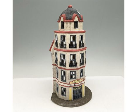 Four story building with cupola and windows with metal window railings. Colored in red, grey and stone. Light accessory can b