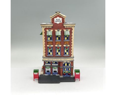 Handpainted matte porcelain figure modelled as a three-story Washington Street Post Office building. Includes two separate me