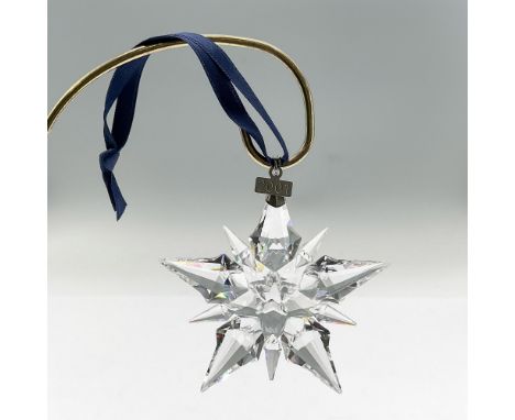 Brilliant star or snowflake shaped tree ornament in clear faceted crystal. Swarovski mark. This item has its original box: 5.