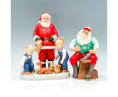 Two adorable Home Interiors and Hallmark porcelain figurines of Santa, one is his workshop painting a toy sailboat and the ot