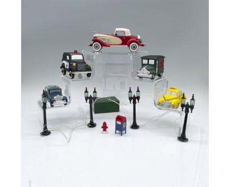 An assortment of small hand painted figure accessories. Includes set of 4 Lamp Post, set of 2 Mail Box and Fire Hydrant, set 