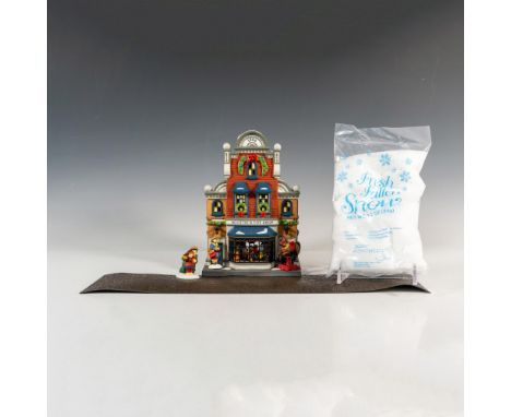 Part of the Heritage Village Collection, and Christmas In the City Series. Hand painted porcelain figure of a colorful toy sh