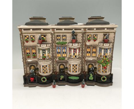 Hand painted brownstone apartment decorated for the holidays. Small topiary plants are individual for the balconies. Departme