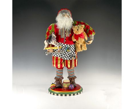 This wide eyed bespeckled Santa wears a rich harlequin sleeved velour work coat and Landsknecht style pants. He wears a work 