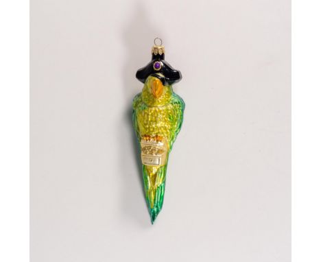 Exquisitely hand-painted glass ornament depicts a green pirate parrot wearing an eye patch and holding a treasure chest, embe