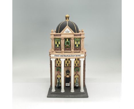 Handpainted matte porcelain three-story bank building with white pillar columns in the front. Part of the Christmas in the Ci