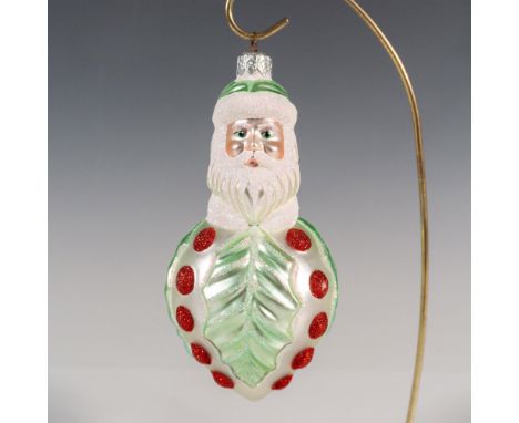 Exquisitely hand-painted, this glass ornament features Santa adorned with a pearl and light green glittered body. Collector K