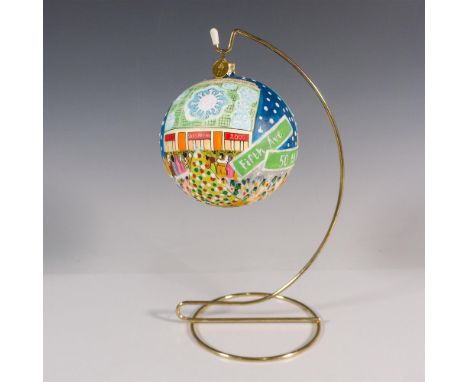 This gorgeous glass globe shaped ornament is hand painted with landmarks of Manhattan. Metal hang tag reads Landmark Creation