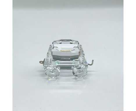 Clear faceted crystal figure of a train car capable of tipping to one side or the other. Swarovski mark. Part of the When We 