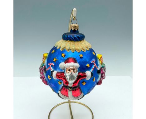 This ball-shaped ornament features Santa and angels wearing red and white outfits with glitter accents, holding candy canes l
