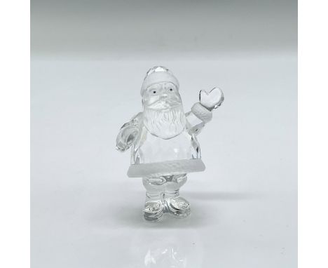 Clear faceted crystal figurine of Santa with blue eyes and frosted crystal accents. Swarovski mark. This item has its origina