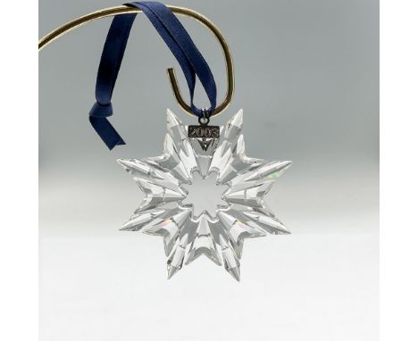 Sparkling star or snowflake shaped tree ornament in clear faceted crystal. Swarovski mark. This item has its original box: 5.