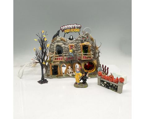 This Fun House really is fun with its lighted windows and creepy eyes peering out at you to the skeleton to the boy in the re