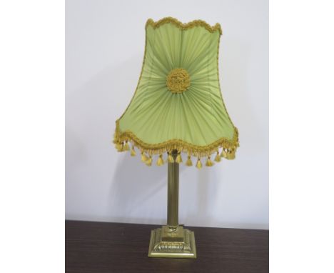 A 1960s brass table lamp of Corinthian column form, with period shade - 60cm high - indentation to base 