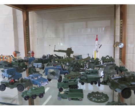 An assortment of die cast military vehicles including Dinky, Britains, and Lesney, all play worn, approx 30 in total 