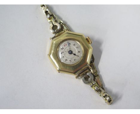 An 18ct EB Co ladies octagonal manual wristwatch on a plated strap, not working, total weight approx 22 grams 