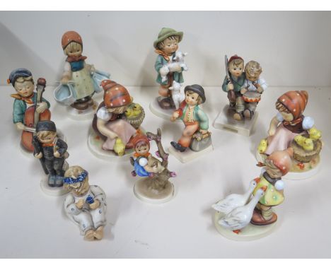 Eleven Hummel and Goebel figurines, largest approx 14cm high, some signs of light wear, one model with chip to its base, see 