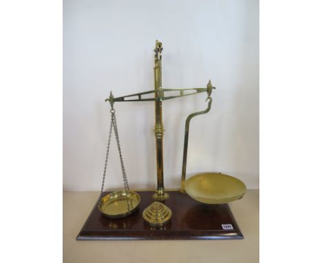 A set of Avery brass scales with six weights, 60cm H x 50cm 