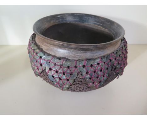 A Chinese coin bowl with ebonised wooden basin externally decorated with Chinese coins and wickerwork, approx 17.5cm H x 26cm