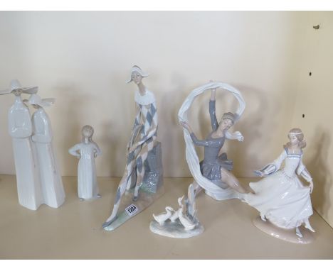 A Lladro group of two nuns, no 4611 boxed, a Lladro Cinderella boxed and four Nao figures, all good except finger broken to C