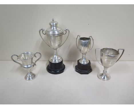 Four 1930's silver trophies of various sizes, approx 5.7 troy oz, two with ebonised stands, awards for hospital meeting Ince 