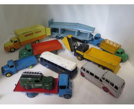 Six Dinky toy lorries, a Pullmore transporter observation coach and BOAC coach and a telephone service van, all original pain