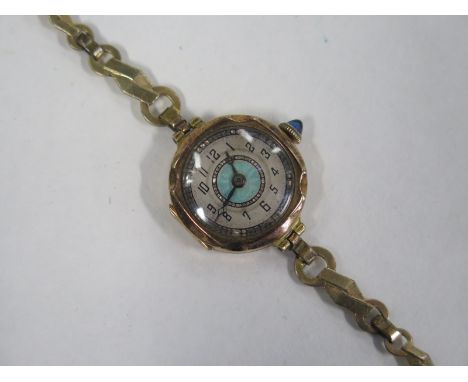 An 18ct ladies manual wind wristwatch head on a plated strap, not working and strap broken, total weight approx 13 grams 