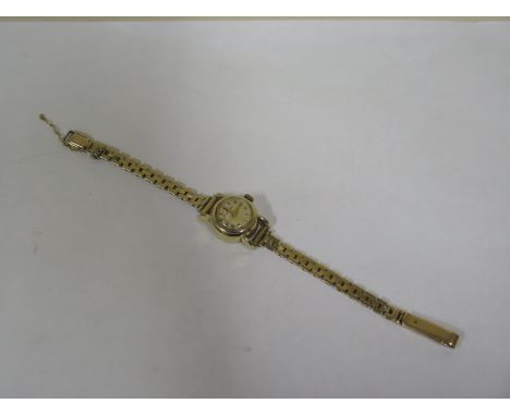 An Eterna Matic 9ct yellow gold manual wind ladies wristwatch, approx total weight 18.5 grams, some general wear, safety chai