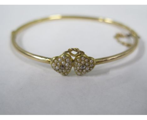 A gilt metal pearl heart bangle set with two small diamonds - 7cm x 6cm - approx 5.8 grams, old repairs/split to bangle, all 