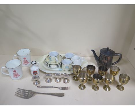 A collection of military ceramics and plated wares - most stamped with a broad arrow or bearing a regimental insignia, togeth