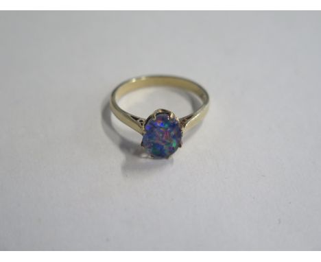 A 9ct gold opal style stone ring, approx 2.5 grams, size O, some cosmetic wear 