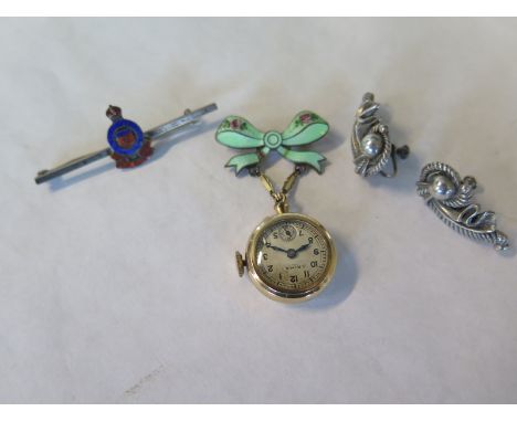 A pair of silver earrings, a silver Army Ordinance sweetheart brooch and a Rima manual wind lapel watch on an enamel bow broo