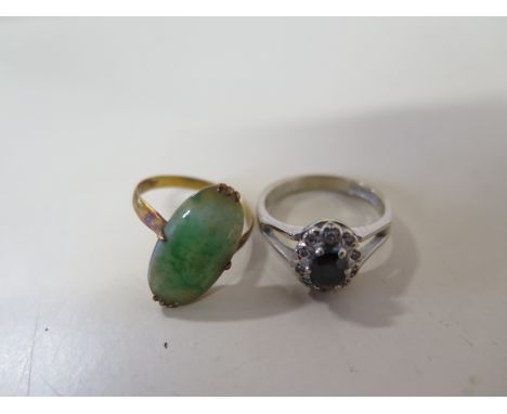 An 18ct white gold sapphire and diamond ring, size N, approx 4.4 grams, some usage marks but generally good, and a 14ct jade 