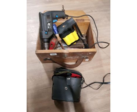 A WOODEN BOX CONTAINING BINOCULARS AND ASSORTED TOOLS INC HAMMER DRILL ETC
