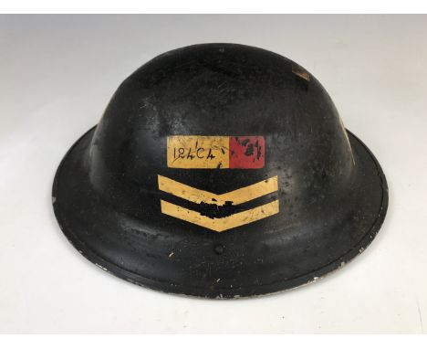 A Second World War Civil Defense Repair Party helmet