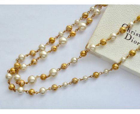A Mitchel Maer for Bijou Christian Dior faux pearl and gilt-metal bead rope necklace, in original carton, 80 cm
