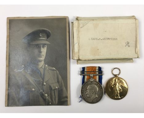 A British War and Victory Medal pair to Lieutenant H Griffiths, Royal Sussex Regiment together with issue cartons and portrai