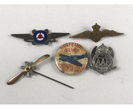 A group of aviation brooches and lapel badges including a mobile rotary aero engine pin 