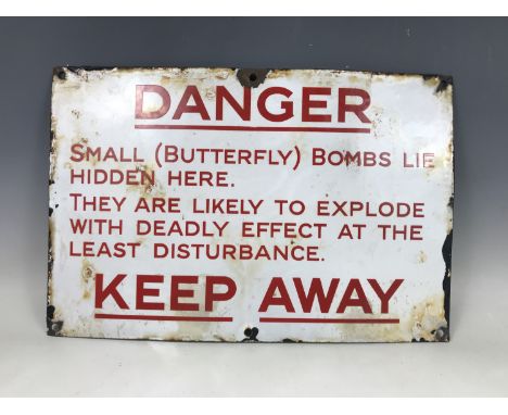 A Butterfly bomb enamel warning sign, 30 cm x 47 cm