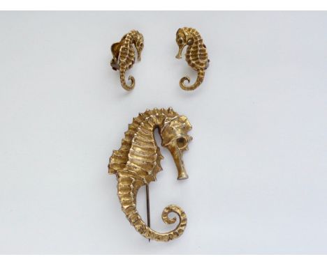 A vintage gilt white-metal seahorse garniture, comprising brooch and a pair of clip-on earrings, stamped 'silver', second qua