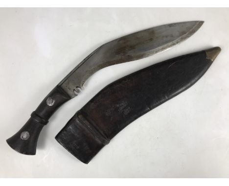 A Second World War military issue kukri, both scabbard and blade dated 1945