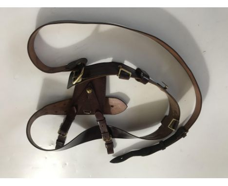 A British Army officer's Sam Browne belt, shoulder strap and sword frog