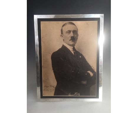 An early signed portrait of Adolph Hitler, being a period monochrome offset lithographic print of a three-quarter length phot