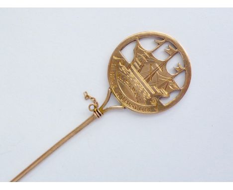 An antique yellow-metal Kirkwall Orkney souvenir stick pin, having a reticulated and engraved terminal depicting a sailing sh