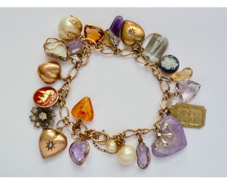 A lady's 9ct gold curb-link charm bracelet and gemstone charms, the latter including a David Andersen guilloche enamelled fob