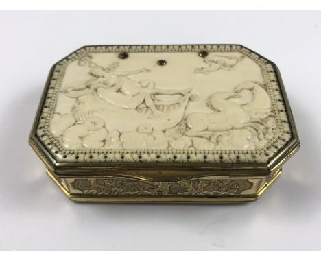 An 18th Century carved ivory and gilt-metal snuff box, of rectangular section with canted corners, the cover carved in a bas-