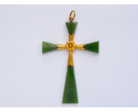A vintage high-carat yellow-metal and jade cruciform pendant, having a central yellow-metal mount set with a textured flower 