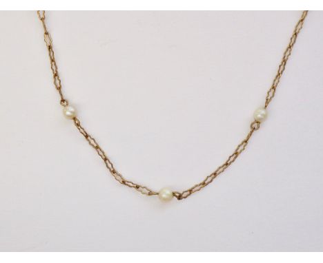An early 20th Century fine yellow-metal and pearl neck chain, having cusped links interspersed by single pearls of approximat