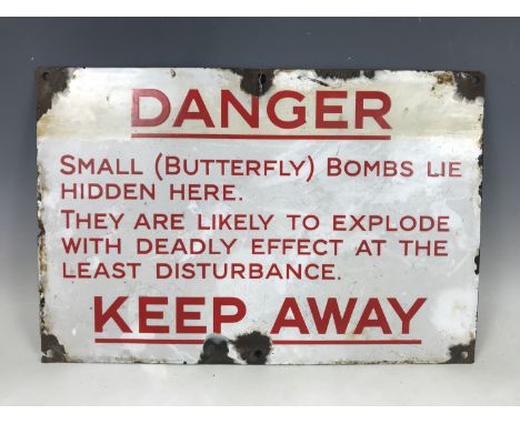 A Butterfly bomb enamel warning sign, 30 cm x 47 cm